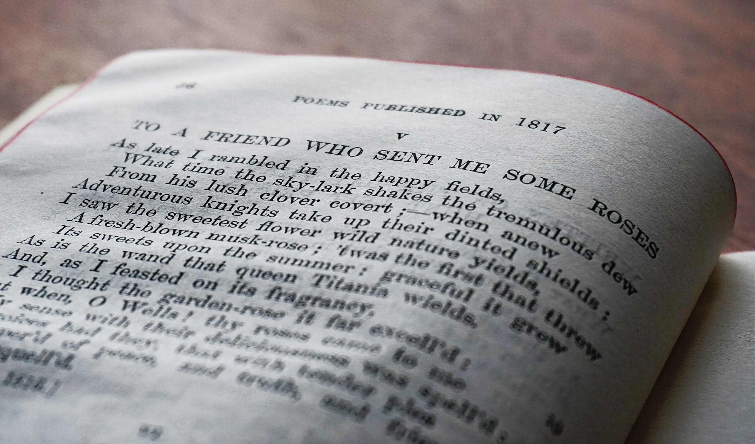 An open vintage, classic book with lines from a script.