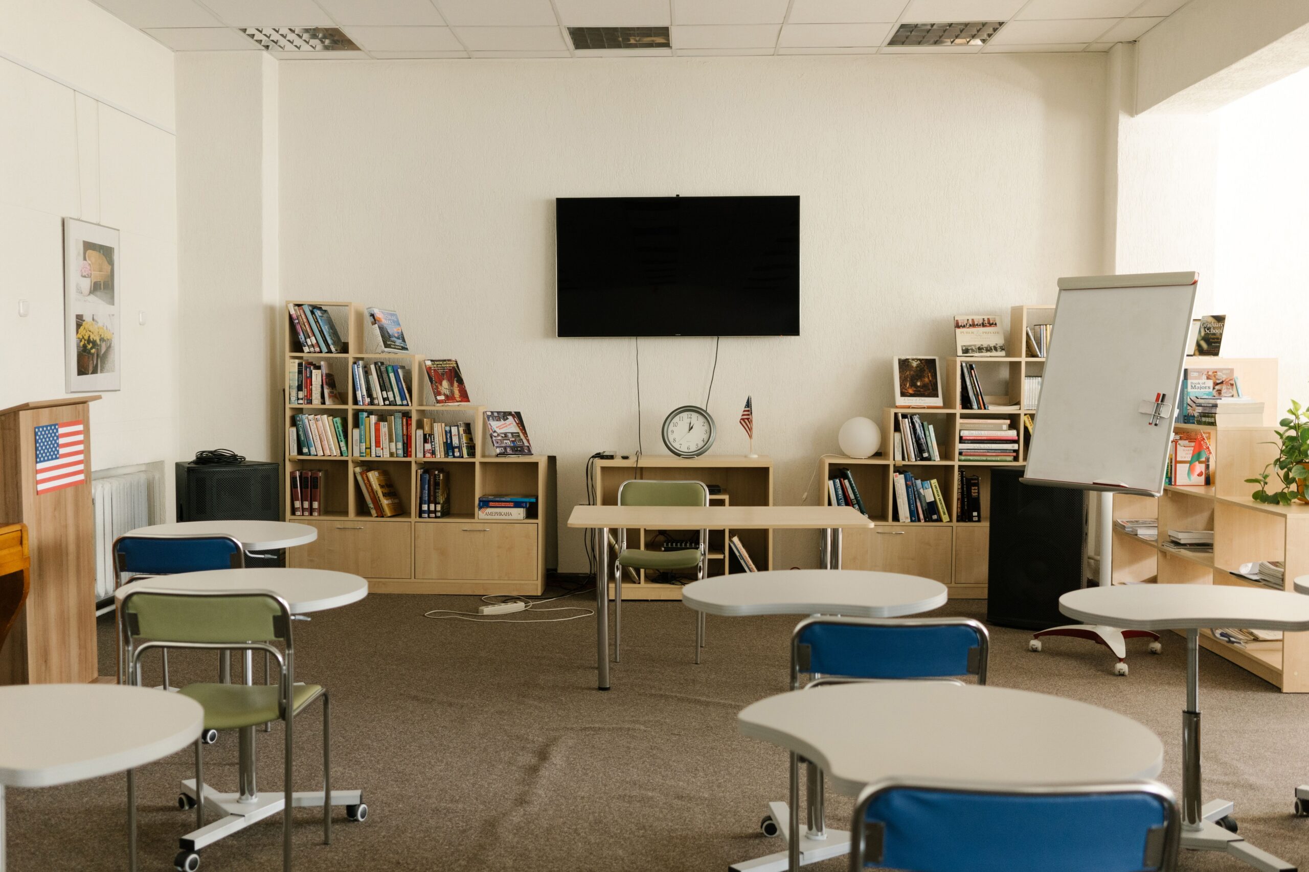 A classroom with a modern seating arrangement and colorful supplies